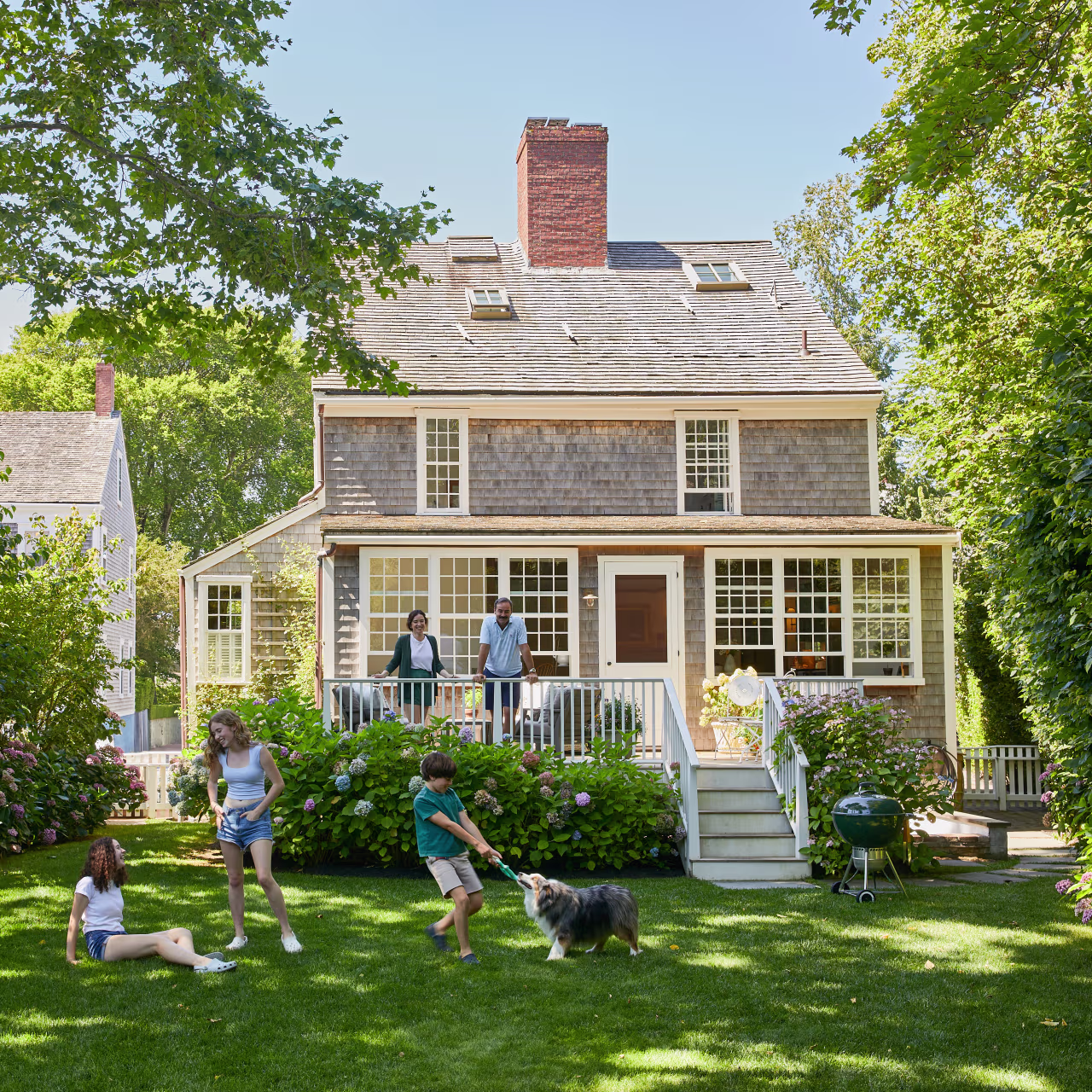 A shingled Nantucket cottage and garden in summer